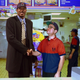 Taco Bell store manager Roy DiNardo (right) welcomes draftee Antwaine Hooks to the team. The former college All-American is expected to start immediately.